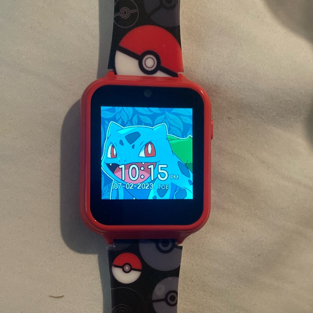 Red and Black Pokémon smart Watch w/ charger cord- records videos and pictures